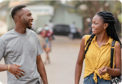 Black man and woman walking and talking with each other