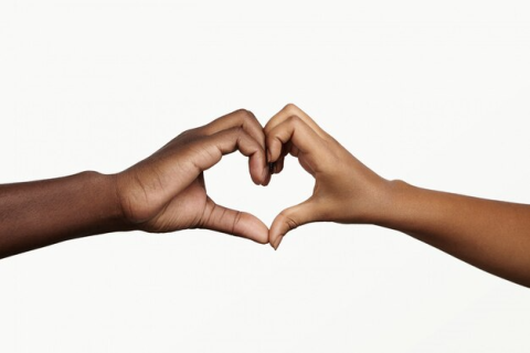 Two hands together making a heart shape